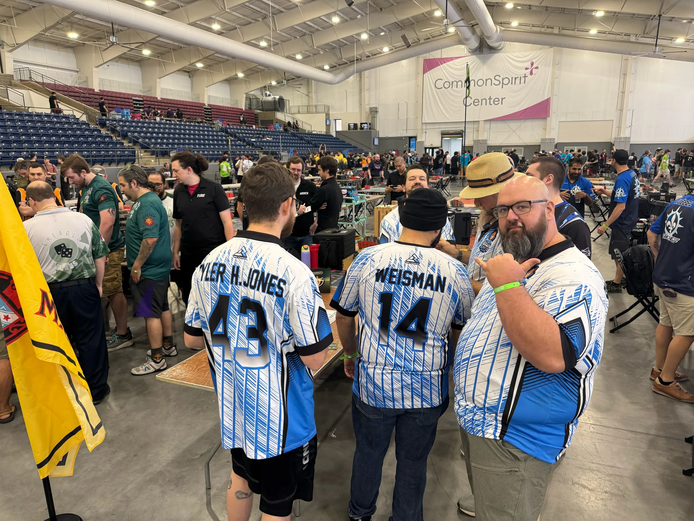 Smite Club members in team jerseys together on the Challengers Cup tournament floor