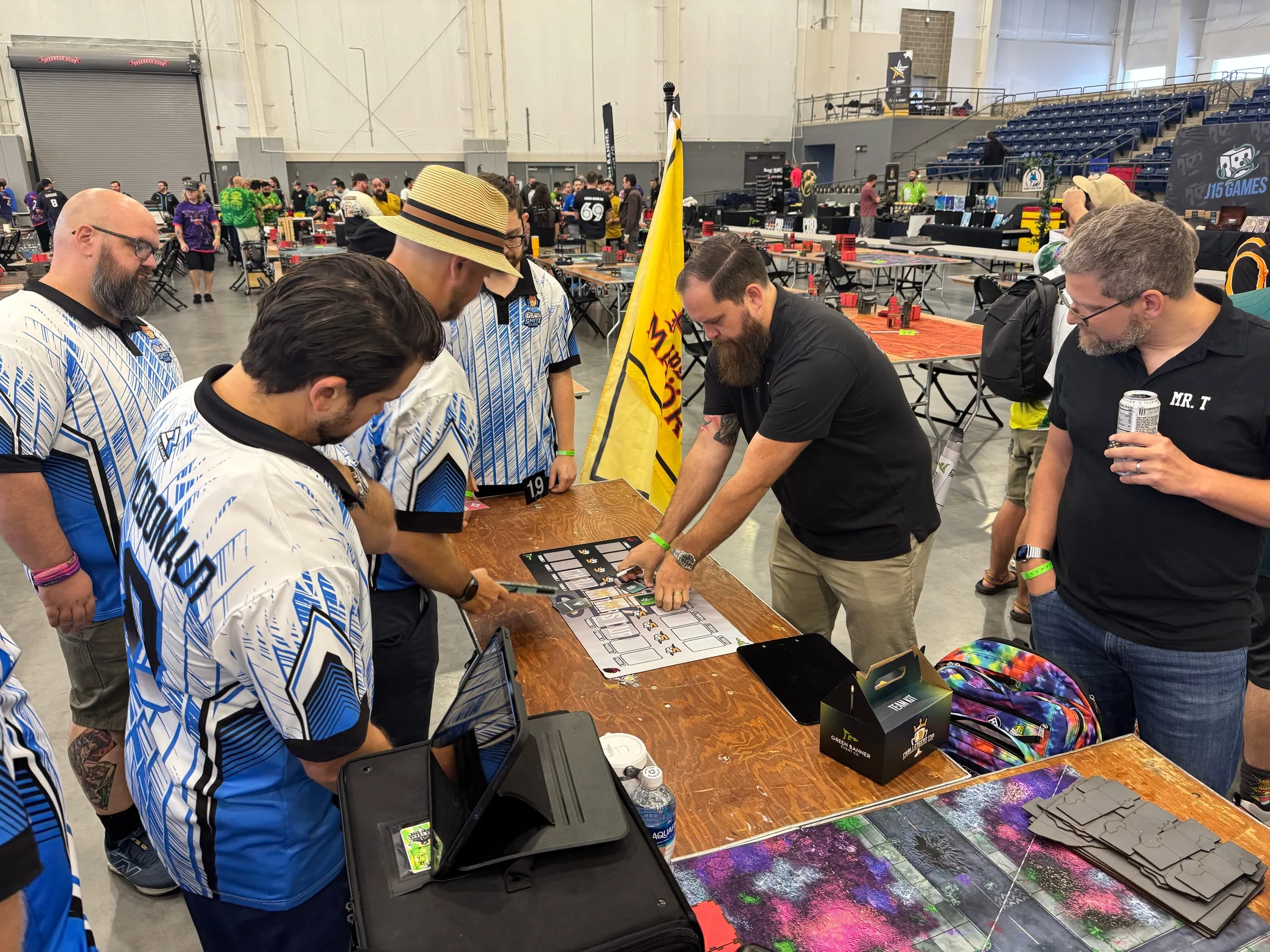 Smite Club members gathered around a team pairing board at Challengers Cup