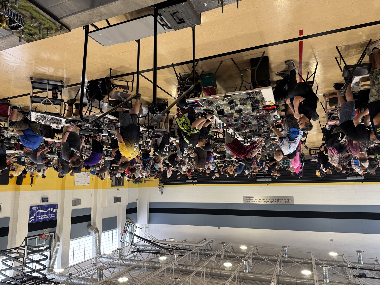Rows of tables fill the gym floor during a round at Smite Club Open 2026