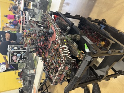 An army display board on a cart between rounds