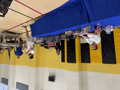 The prize table set up along the gym wall